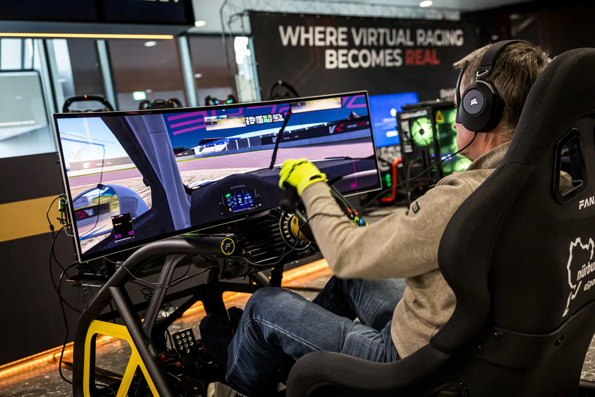 A visitor in a sim racing rig